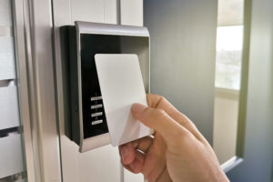 Person using electronic key card at office building